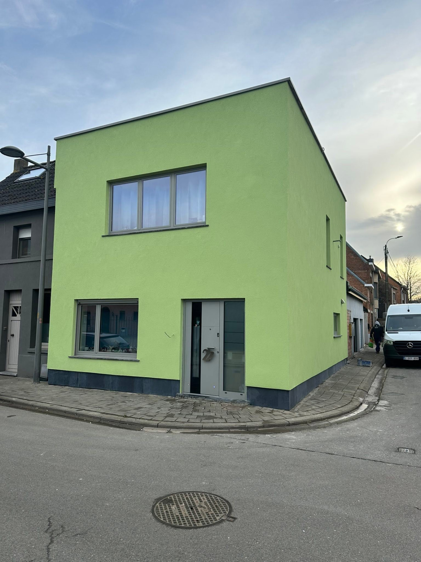 Gevelisolatie hoekwoning met gekleurde sierpleister - Na